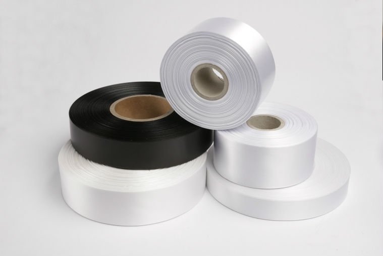 Textile Ribbons — Nylon, polyester, and satin ribbons for care labels. Flame-retardant and wash-resistant options.